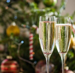 Christmas events, Christmas Day & Festive Events Fizz. Glasses of prosecco being raised at midnight toast